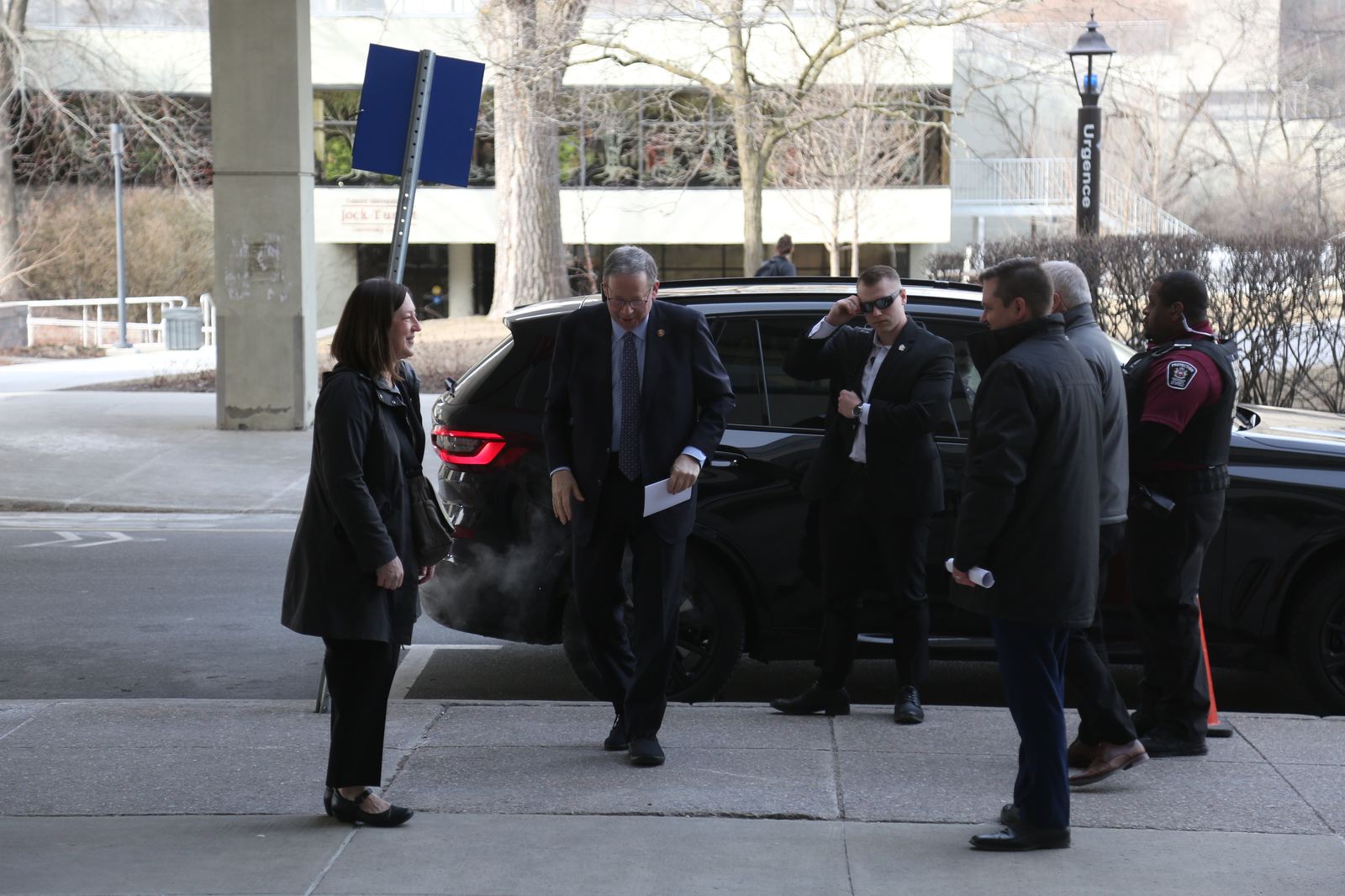 Motorcade arrival with security detail