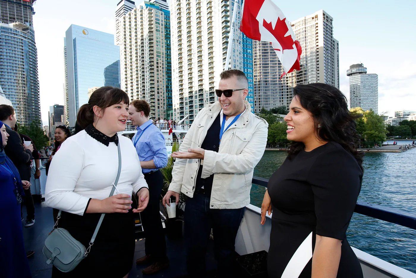 Guests on a harbour cruise under a Canadian flag