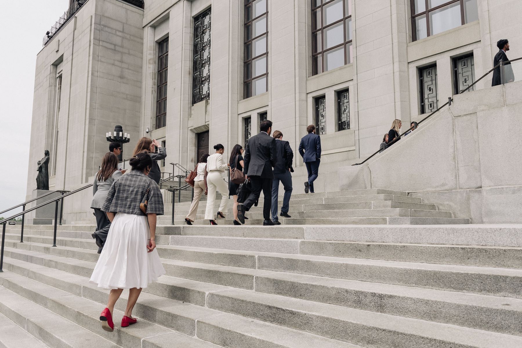 Delegates ascending the steps of the Supreme Court of Canada in Ottawa